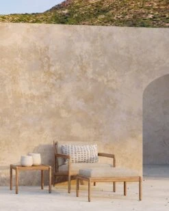 Muir Outdoor Footstool 14 Muir Outdoor Footstool -Saffron + Poe 10240 Teak Jack outdoor lounge chair natural 10247 Teak Jack outdoor footstool 10257 Jack side table 21101 Cushion white dots Saffron and Poe Ethnicraft