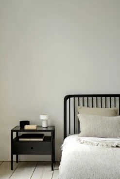 Mendocino Bed - Black Oak -Saffron + Poe 51236 51235 Oak black Spindle bed bedside table 21051 21052 Oat Nomad throw cushion 21053 Oat lin det Saffron and Poe Ethnicraft