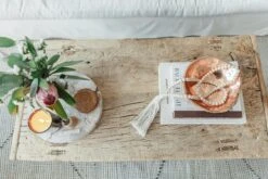 Travel Home: Design With A Global Spirit -Saffron + Poe Above Styled Travel Home and Architectural Digest at 100 books on Antique Chinese Coffee Table and Bali Beads