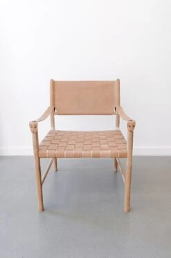 Safari Lounge Chair - Beige -Saffron + Poe Front Leather Strap Safari Lounge Beige against white wall